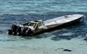 This drug-running speed boat washed into Arno Atoll in early February. Known by law enforcement as a “narco boat,” the vessel sports four big outboard engines for high speed transport of drugs in the submarine-like enclosed hull. No drugs were recovered from this boat by law enforcement.