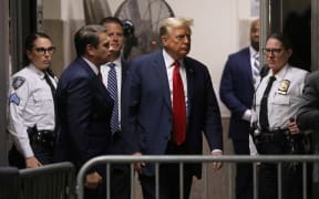 NEW YORK, NEW YORK - APRIL 15: Former U.S. President Donald Trump returns to the courtroom after a break on the first day of his trial for allegedly covering up hush money payments at Manhattan Criminal Court on April 15, 2024 in New York City. Trump was charged with 34 counts of falsifying business records last year, which prosecutors say was an effort to hide a potential sex scandal, both before and after the 2016 presidential election. Trump is first former U.S. president to face trial on criminal charges.   Jefferson Siegel-Pool/Getty Images/AFP (Photo by POOL / GETTY IMAGES NORTH AMERICA / Getty Images via AFP)