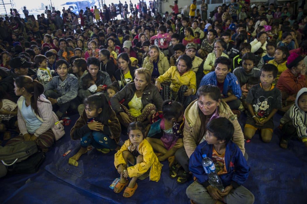 Residents displaced by massive flood waters from the collapsed dam seek shelter in Paksong town in Champasak province on July 25, 2018.