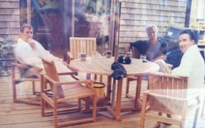 This undated photo in an unidentified location provided by the US Department of Justice on March 13, 2026 shows, Andrew Mountbatten-Windsor and Lord Peter Mandelson wearing bathrobes seated alongside late financier and convicted sex offender Jeffrey Epstein. Epstein Files Transparency Act (EFTA) passed by Congress and signed into law by US President Donald Trump mandated the complete release of the Epstein files by December 19, 2025. (Photo by Handout / US Department of Justice / AFP) / RESTRICTED TO EDITORIAL USE - MANDATORY CREDIT "AFP PHOTO / US Department of Justice" - HANDOUT - NO MARKETING NO ADVERTISING CAMPAIGNS - DISTRIBUTED AS A SERVICE TO CLIENTS