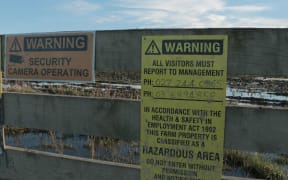 A warning sign on the gate of one of the infected farms.