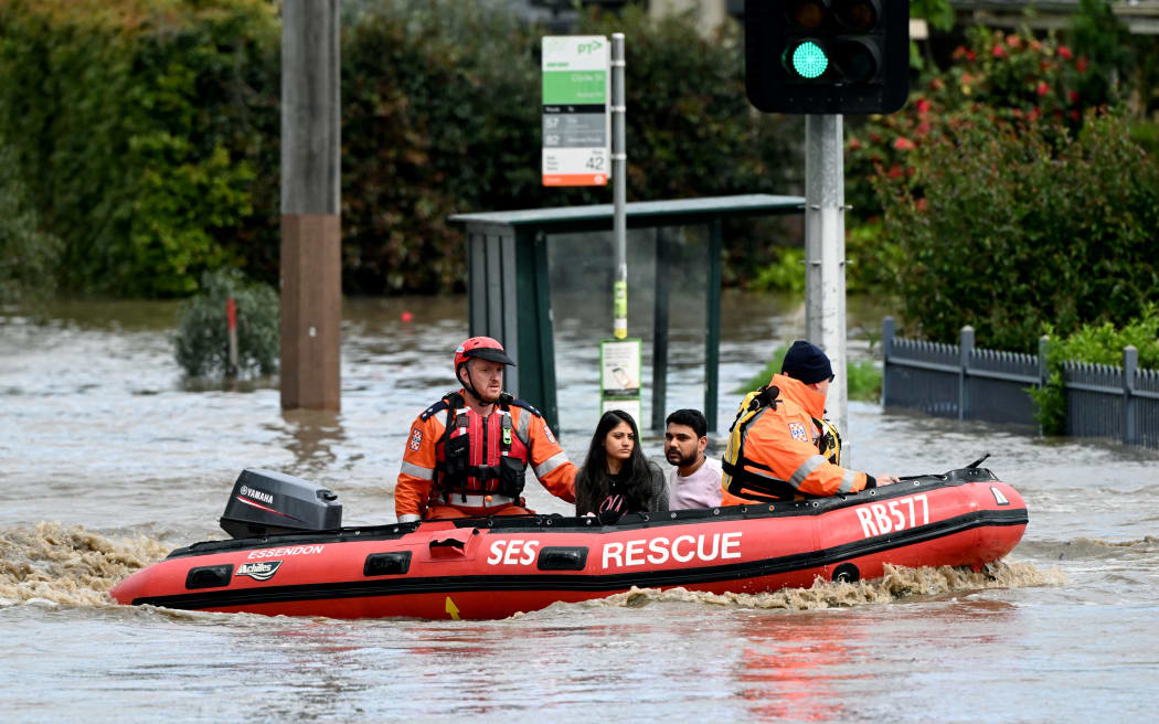 Emergency workers evacuate residents from flooded properties in the Maribyrnong suburb of Melbourne on October 14, 2022.