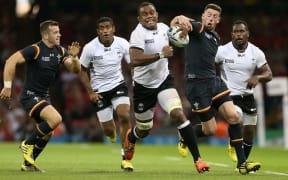 Leone Nakarawa makes a run against Wales at RWC 2015.