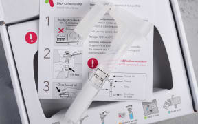 Personal ancestry genetic test saliva collection kit, with tube, box and instructions.