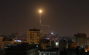 Israeli missile launched from the Iron Dome defence missile system, designed to intercept and destroy incoming short-range rockets and artillery shells, is seen above Gaza city on November 13, 2019. (Photo by MAHMUD HAMS / AFP)
