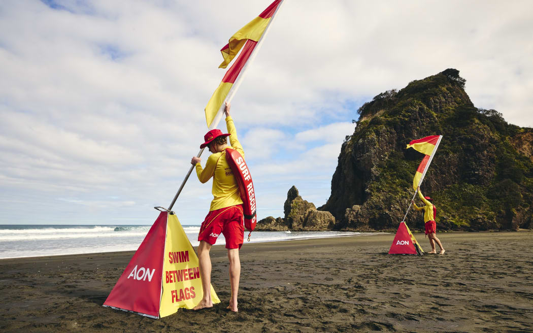 Surf life savers at Piha Beach, west of Auckland City, which is considered one of New Zealand’s most dangerous beaches.