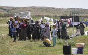 A refugee camp near Polikastro, Northern Greece. A record 65.3 million people were uprooted worldwide last year.