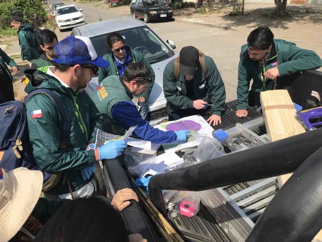 Dr Ed Massey (lef, with cap) and other BMSB Council reps on a surveillance operation in Chile
