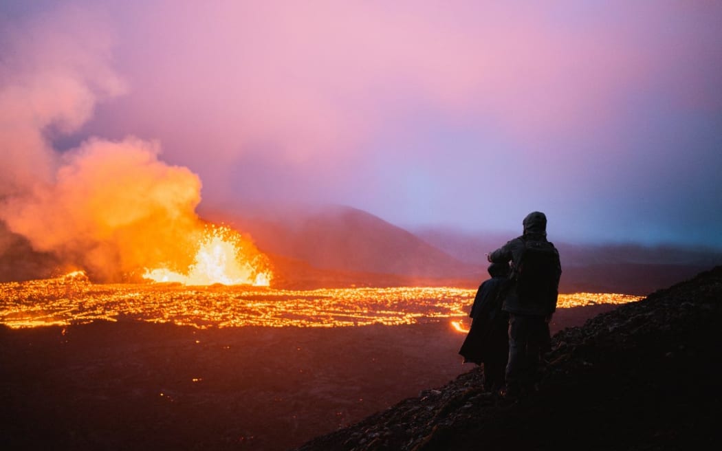 A new volcano near Mount Fagradalsfjall, active for barely a week, already attracts many tourists who hastened to come and admire a rather accessible and unique spectacle. Photograph by Lucas Frayssinet / Hans Lucas.
Islande, a proximite du mont Fagradalsfjall, 2022-08-11. Le nouveau volcan a proximite du mont Fagradalsfjall actif depuis a peine une semaine, attire deja de nombreux touristes qui s empresserent de venir admirer un spectacle plutot accessible et unique en son genre.  
Photographie de Lucas Frayssinet / Hans Lucas. (Photo by Lucas Frayssinet / Hans Lucas / Hans Lucas via AFP)
