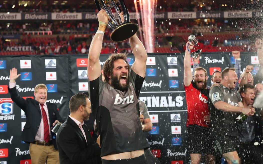 Sam Whitelock of the Crusaders lifts trophy after winning the 2017 Super Rugby Final against the Lions last year.