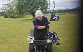 Cathie Braun on the course in her specially designed golf chair