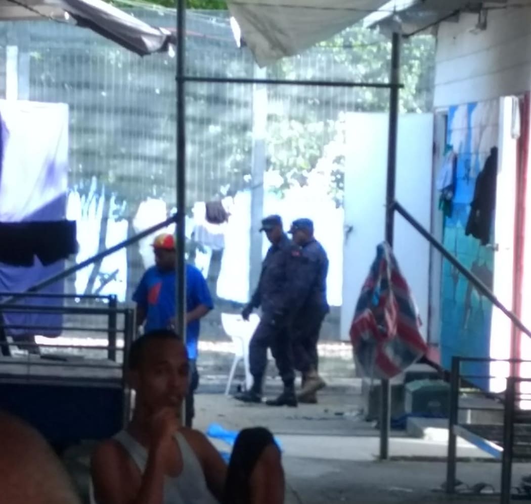 Members of the PNG Navy arrives at the Manus compound.