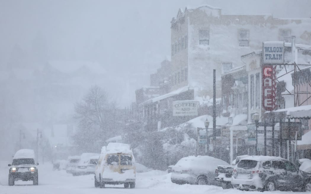 TRUCKEE, CALIFORNIA - MARCH 02: Snow falls downtown, north of Lake Tahoe, during a powerful multiple day winter storm in the Sierra Nevada mountains on March 02, 2024 in Truckee, California. Blizzard warnings were issued with snowfall of up to 12 feet and wind gusts over 100 mph expected in some higher elevation locations. Yosemite National Park is closed and a 50-mile stretch of Interstate 80 was shut down yesterday due to the storm.   Mario Tama/Getty Images/AFP (Photo by MARIO TAMA / GETTY IMAGES NORTH AMERICA / Getty Images via AFP)