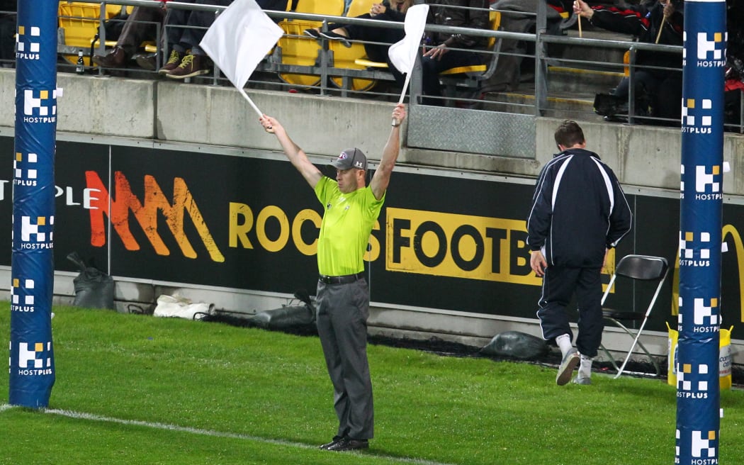 An AFL referee in action