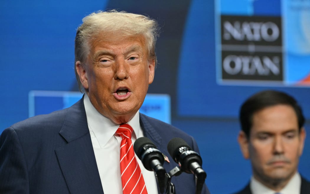 US Secretary of State Marco Rubio (R) listens as US President Donald Trump addresses a press conference during a North Atlantic Treaty Organization (NATO) Heads of State and Government summit in The Hague on June 25, 2025.