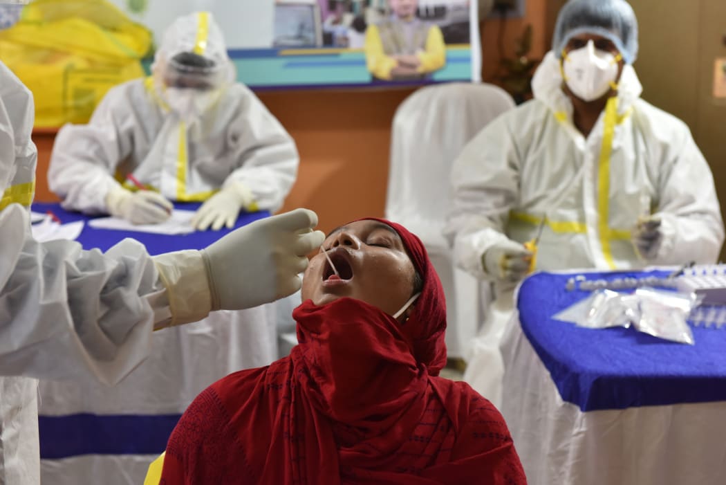 A girl gets tested for Covid-19 in Kolkata.