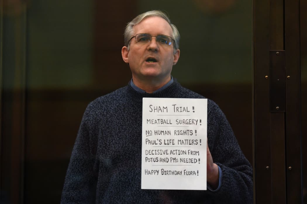 Paul Whelan, a former US marine accused of espionage and arrested in Russia in December 2018, stands inside a defendants' cage as he waits to hear his verdict in Moscow on 15 June 2020.