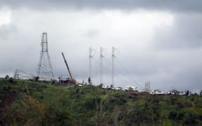 Workers restore high tension power lines damaged by Hurricane Maria in Guayama, Puerto Rico.