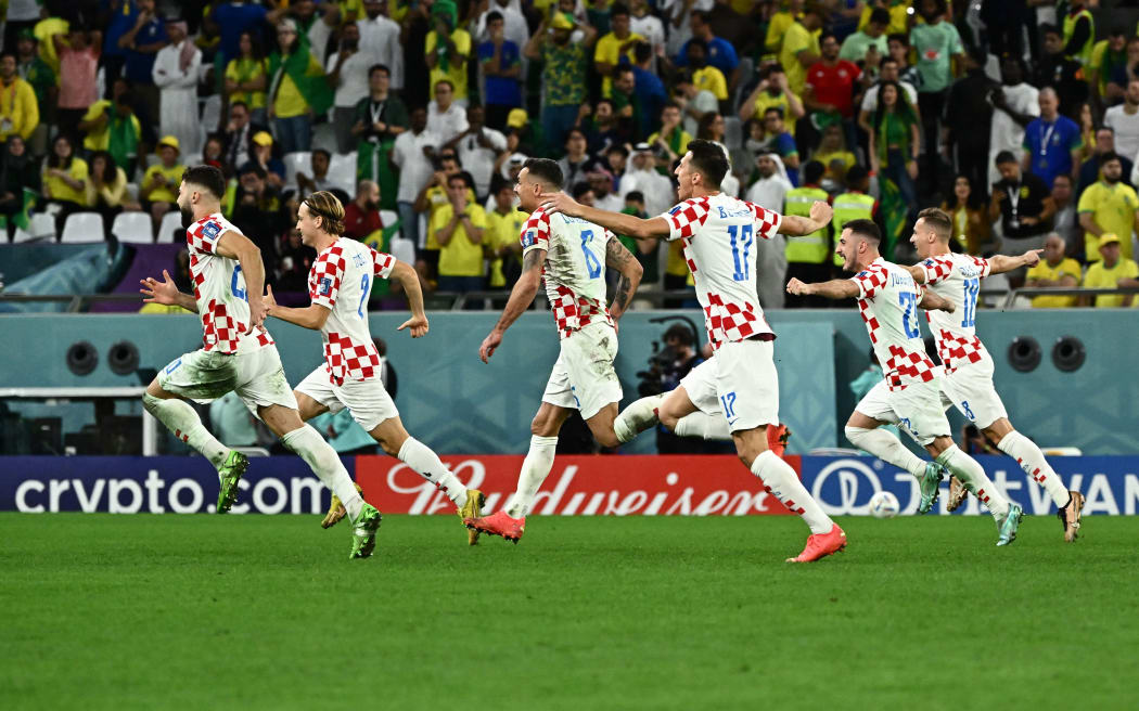 Players of Croatia celebrate after beating Brazil at the World Cup.