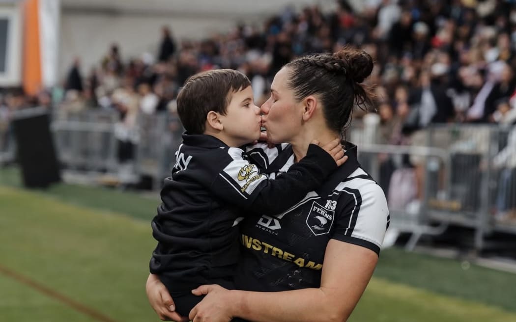 Māori Wāhine Toa All Star Shanice Parker and her son.