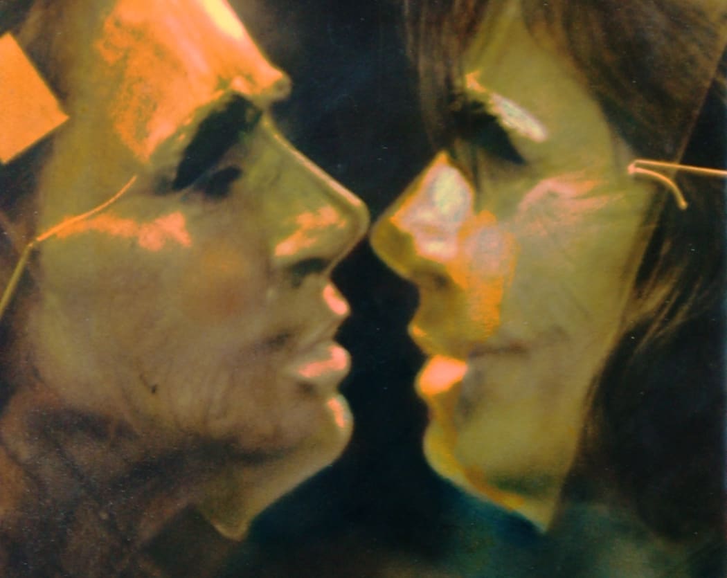 Masks cover male and female faces