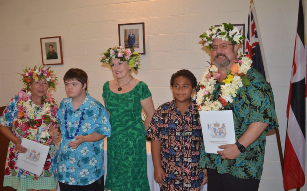 Elizabeth “Betsy” Althea Eisler and Grant Michael Walker both received their New Zealand citizenship. They are pictured with their two children and New Zealand High Commissioner Catherine Graham. MELINA ETCHES/25040306
