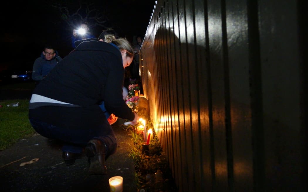Neighbours and friends lit candles at the Onehunga home.