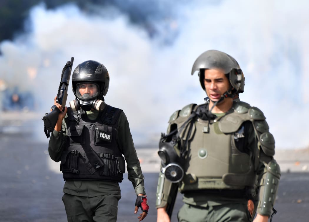 Security forces clash with opposition demonstrators.