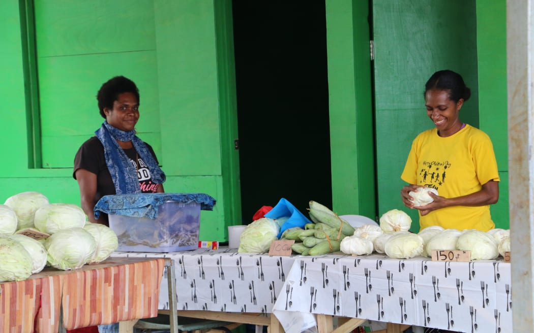 Matty Mark, right, at her staff at the Korman Market in Port Vila. 20 August 2023
