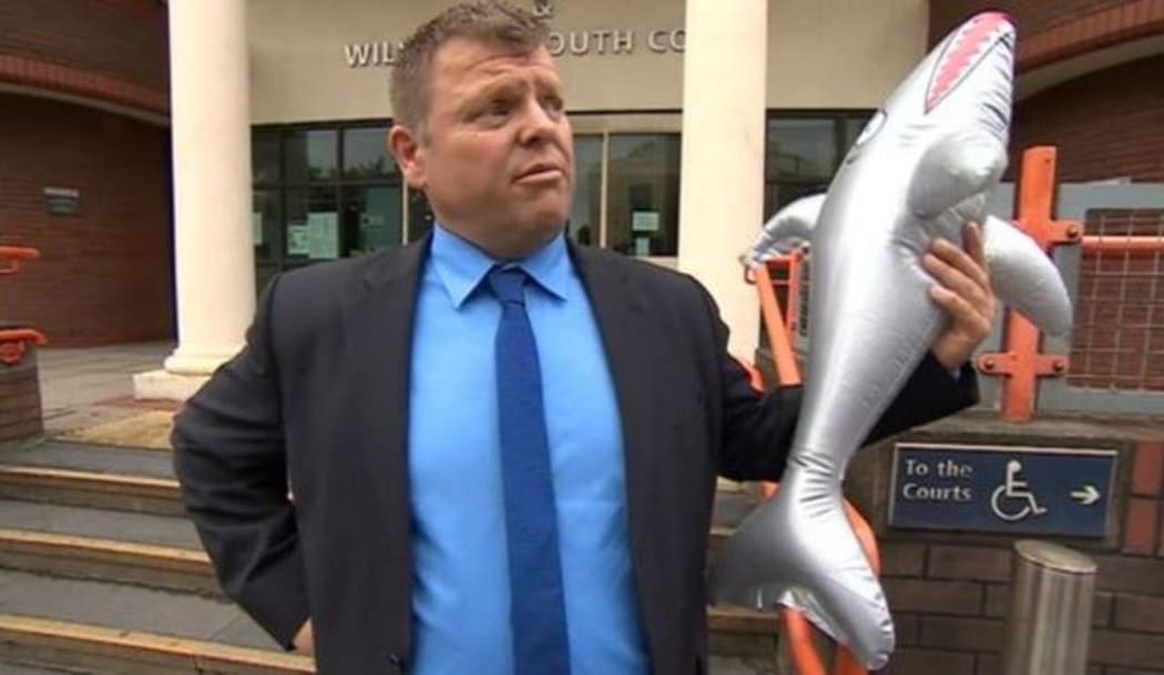 Grimsby Town supporter Kenneth Meech and the offending inflatable shark.