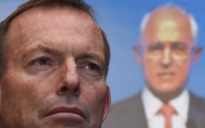 Tony Abbott listens to Australian Prime Minister Malcolm Turnbull address party members at the Coalition Campaign Launch in Sydney on 26 June, 2016.