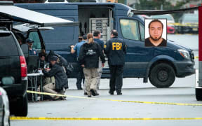 FBI officers work at the site where Ahmad Khan Rahami, inset, was arrested after a shoot-out.