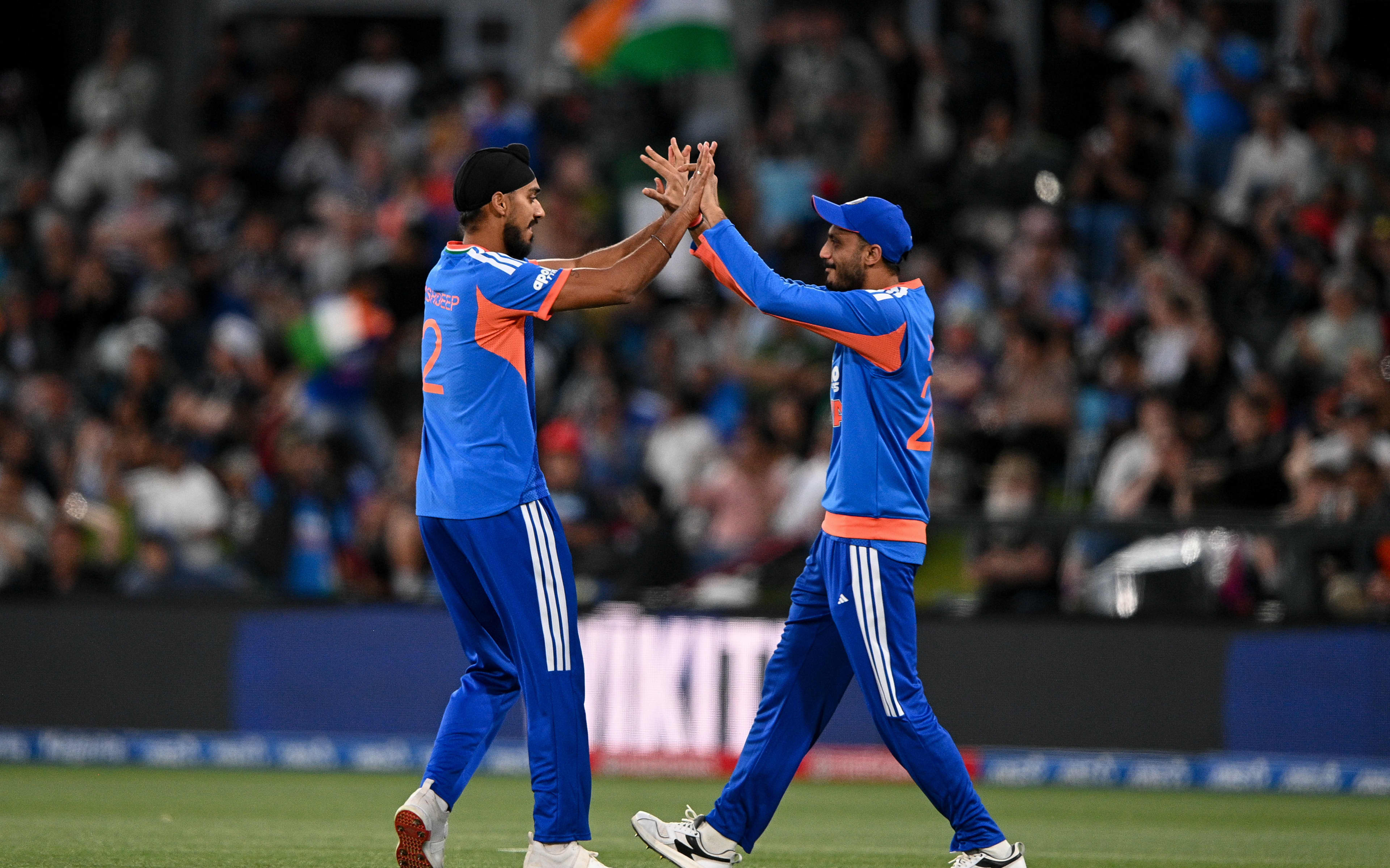 Arshdeep Singh of India celebrates a wicket.