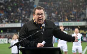 New Zealand minister of sport Grant Robertson speaks about the COVID-19 coronavirus before the Super Rugby match between the Otago Highlanders and Waikato Chiefs at Forsyth Barr Stadium in Dunedin on June 13, 2020. (Photo by Marty MELVILLE / AFP)