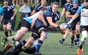 Josh Brajkovic of College Rifles looks to pass during the match between College Rifles and Grammar TEC.