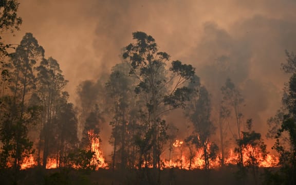 A fire rages in Bobin, 350km north of Sydney on 9 November.