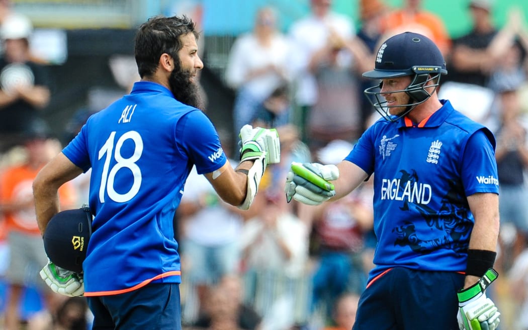 Moeen Ali celebrates his century against Scotland with Ian Bell
