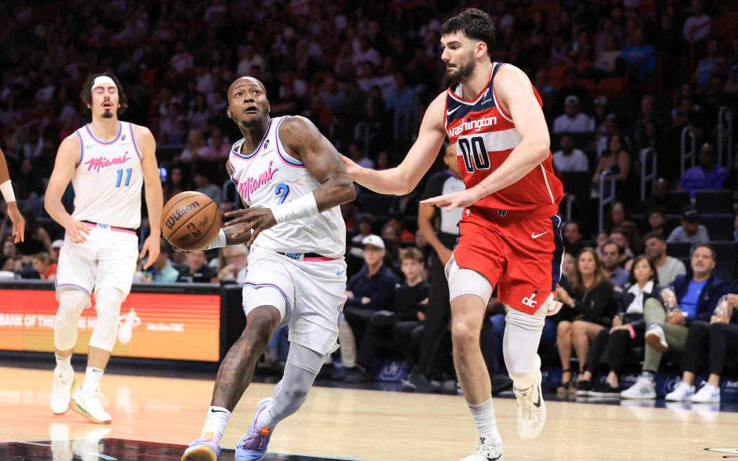 MIAMI, FLORIDA - APRIL 13: Terry Rozier #2 of the Miami Heat drives against Tristan Vukcevic #00 of the Washington Wizards during the fourth quarter of the game at Kaseya Center on April 13, 2025 in Miami, Florida. NOTE TO USER: User expressly acknowledges and agrees that, by downloading and or using this photograph, User is consenting to the terms and conditions of the Getty Images License Agreement. Megan Briggs/Getty Images/AFP (Photo by Megan Briggs / GETTY IMAGES NORTH AMERICA / Getty Images via AFP)