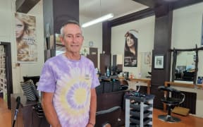 Kim Travers has stored buckets of water, which is then heated on a gas hob, to wash clients' hair at The Little Hair Shop.