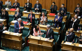 Prime Minister Jacinda Ardern shakes hands with Deputy Prime Minister Winston Peters at the end of her speech in the Budget 2018 debate.