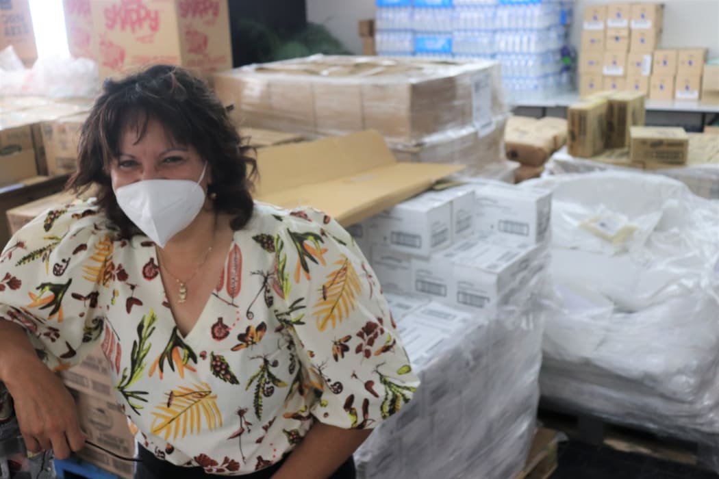 Te Taiwhenua o Heretaunga chief executive Waylan Tahuri-Whaipakanga surrounded by the many kai supplies that are on its way to whānau.