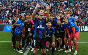 Auckland FC's Tommy Smith takes a team photo.