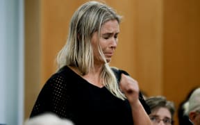 Mieke Elzer, sister of Whakaari victim Rick Elzer speaks at the Auckland District Court as sentencing begins in the Whakaari White Island trial.