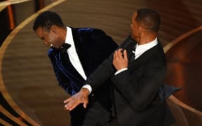 US actor Will Smith slaps US actor Chris Rock onstage during the 94th Oscars at the Dolby Theatre in Hollywood, California on March 27, 2022.