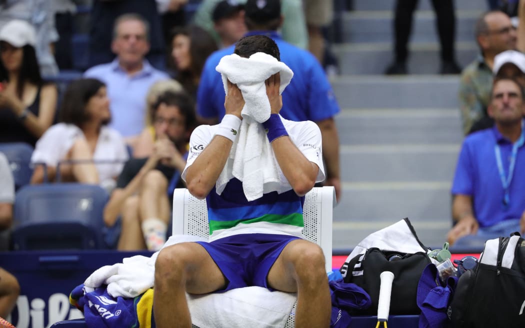 Novak Djokovic of Serbia reacts after Medvedev won their Men's Singles final match 2021 US Open Tennis tournament men's final match at the USTA Billie Jean King National Tennis Center in New York, on September 12, 2021.