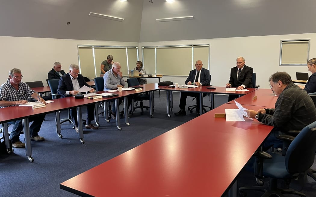 The about to be deposed Allan Birchfield sits stoney faced at the top table, right, prior to the proceedings which resulted in his replacement by councillor Peter Haddock, to  Birchfield's right.