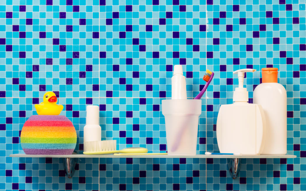 A collection of personal hygiene and body care products, including toothpaste, soap and body wash.