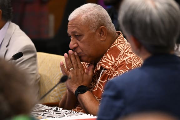 Fiji Prime Minister Frank Bainimarama (C) speaks at the opening remarks of Pacific Islands Forum (PIF) in Suva on July 12, 2022 (Photo by William WEST / AFP)