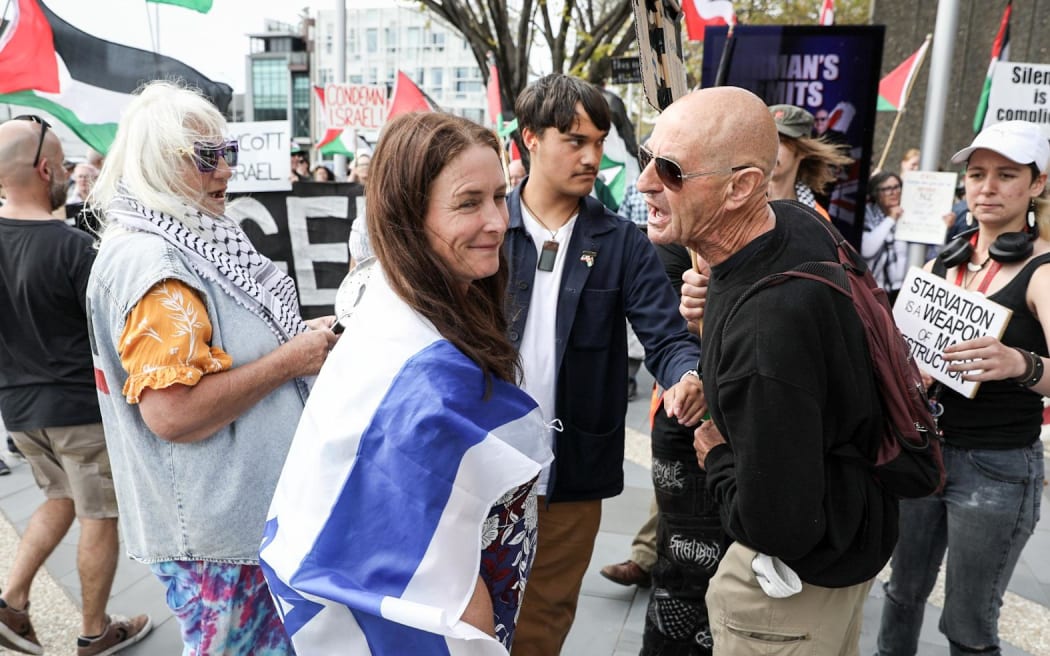Several protesters gathered outside Winston Peters' State of the Nation Speech Sunday, 23 March.