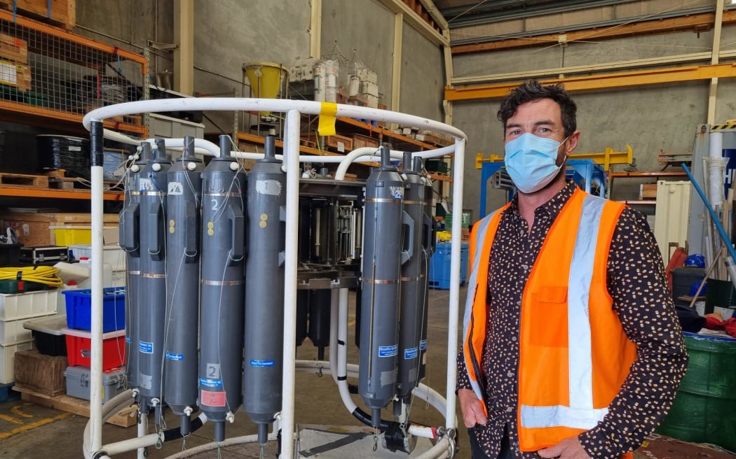 Joshu Mountjoy with a CTD (conductivity, temperature and depth) machine that will be on board the vessel.